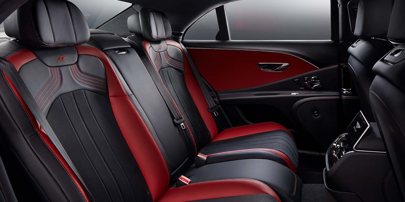 Bentley Manchester Bentley Flying Spur S sedan rear interior in Beluga black and Hotspur red hide with S stitching