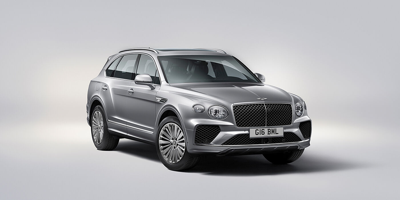 Bentley Manchester Bentley Bentayga luxury SUV front three quarter view in Moonbeam paint with matrix grille and 21″ 5 spoke painted wheels