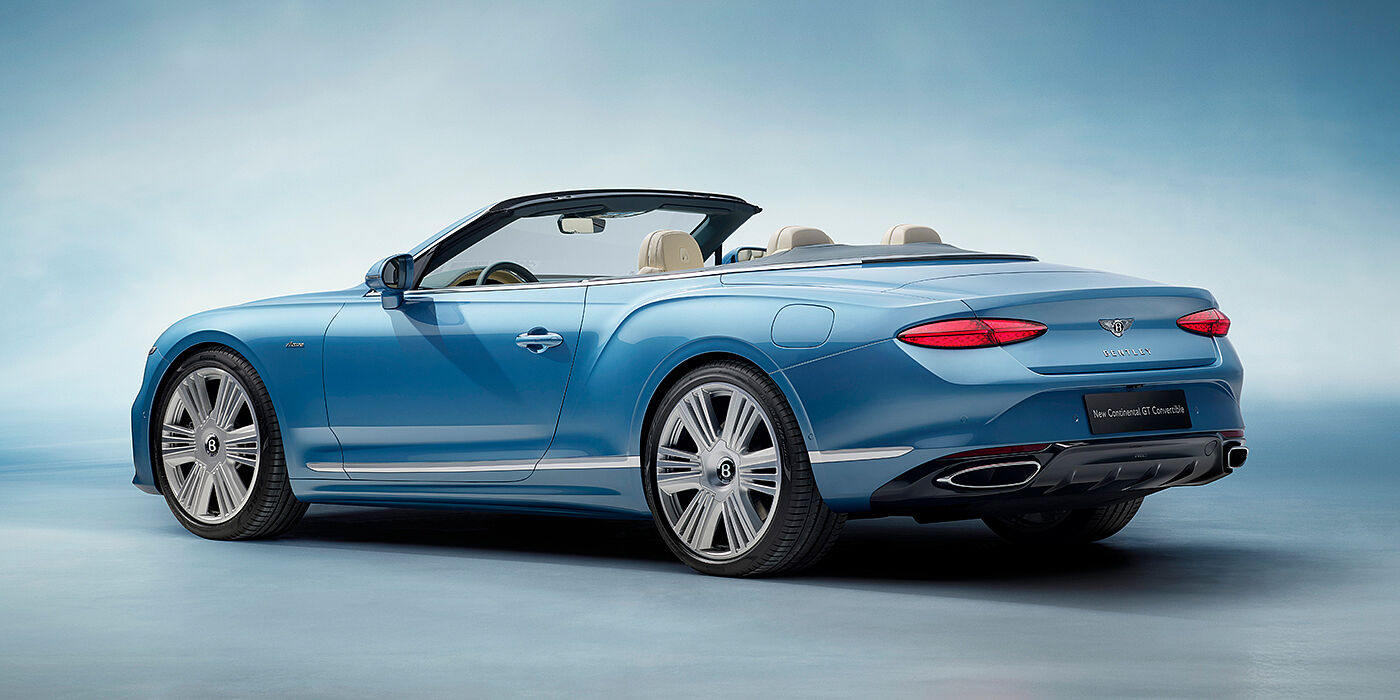 Bentley Manchester New Bentley Continental GTC Azure convertible rear view in Light Windsor blue paint with 22 inch ten spoke wheels and chrome exterior details
