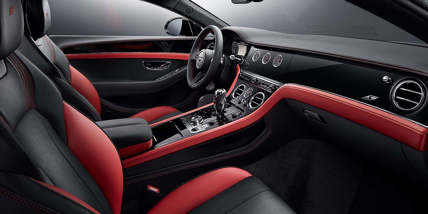 Bentley Manchester Bentley Continental GT S coupe front interior in Beluga black and Hotspur red hide with high gloss Carbon Fibre veneer