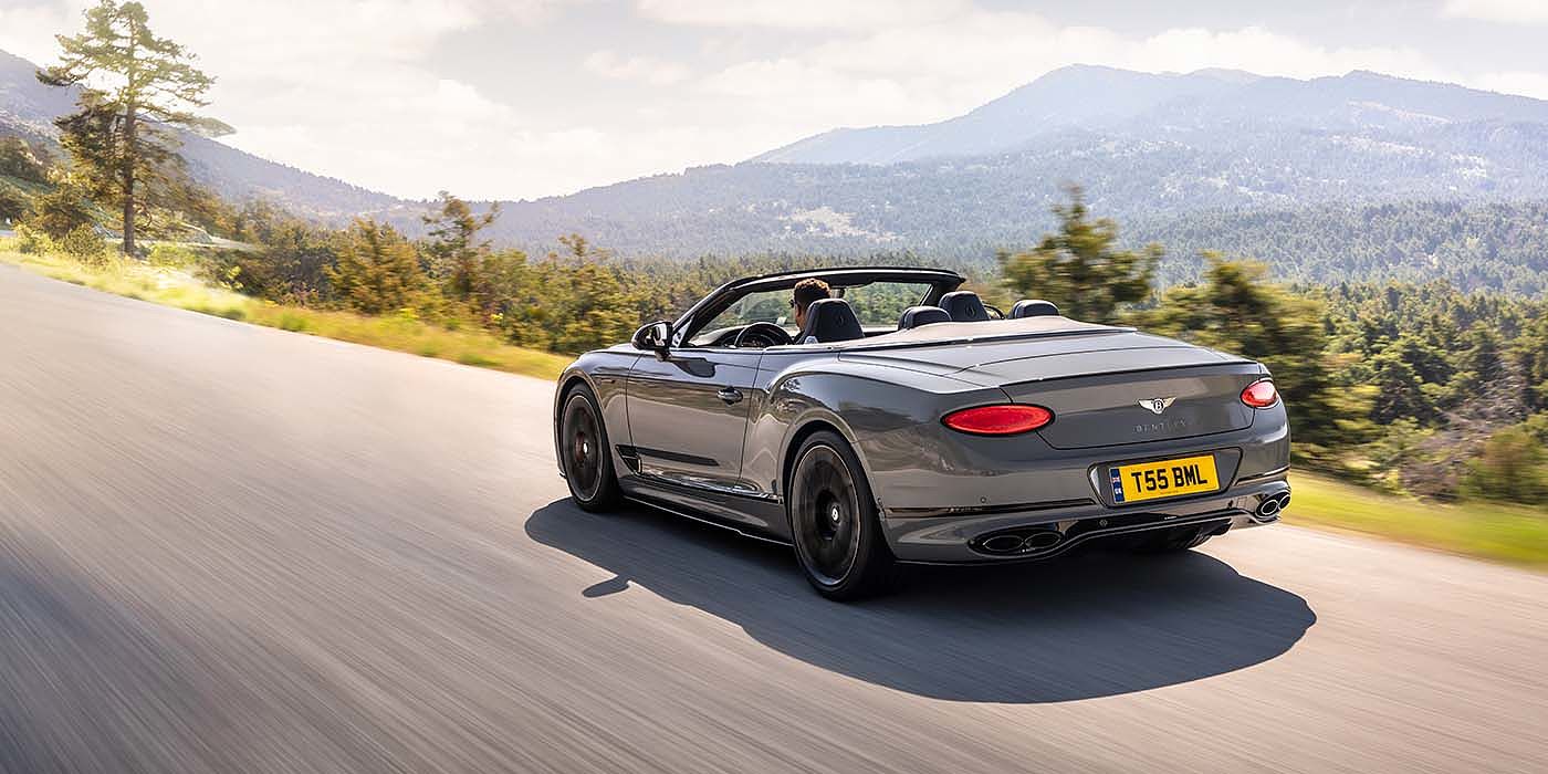 Bentley Manchester Bentley Continental GTC S convertible in Cambrian Grey paint rear 34 dynamic driving