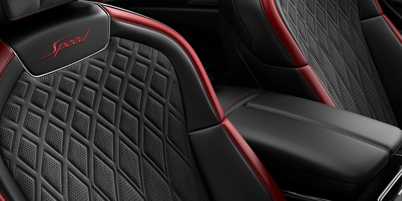 Bentley Manchester Bentley Flying Spur Speed sedan seat stitching detail in Beluga black and Cricket Ball red hide