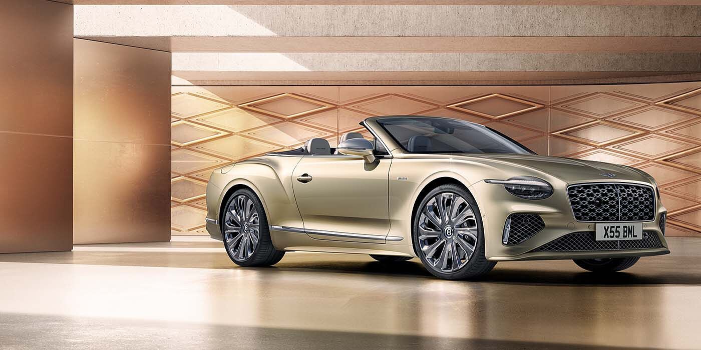 Bentley Manchester Bentley New Continental GTC Mulliner V8 hybrid front three quarters in Patina paint